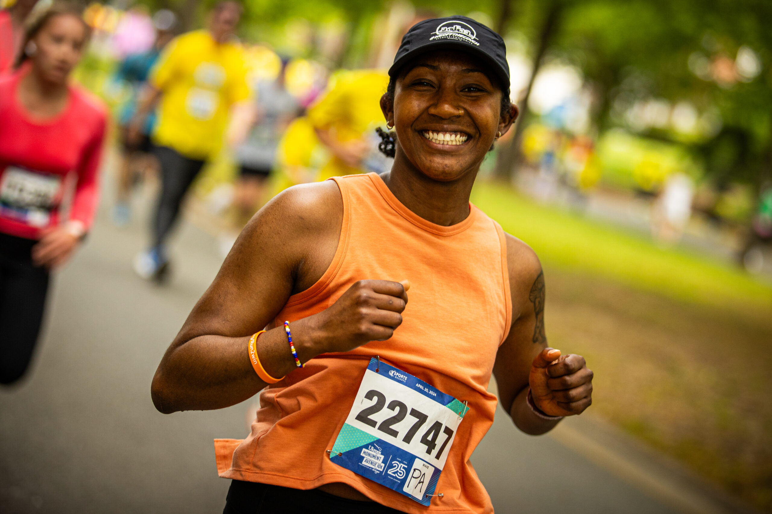 A participant enjoying the Ukrop's Monument Avenue 10k presented by Kroger